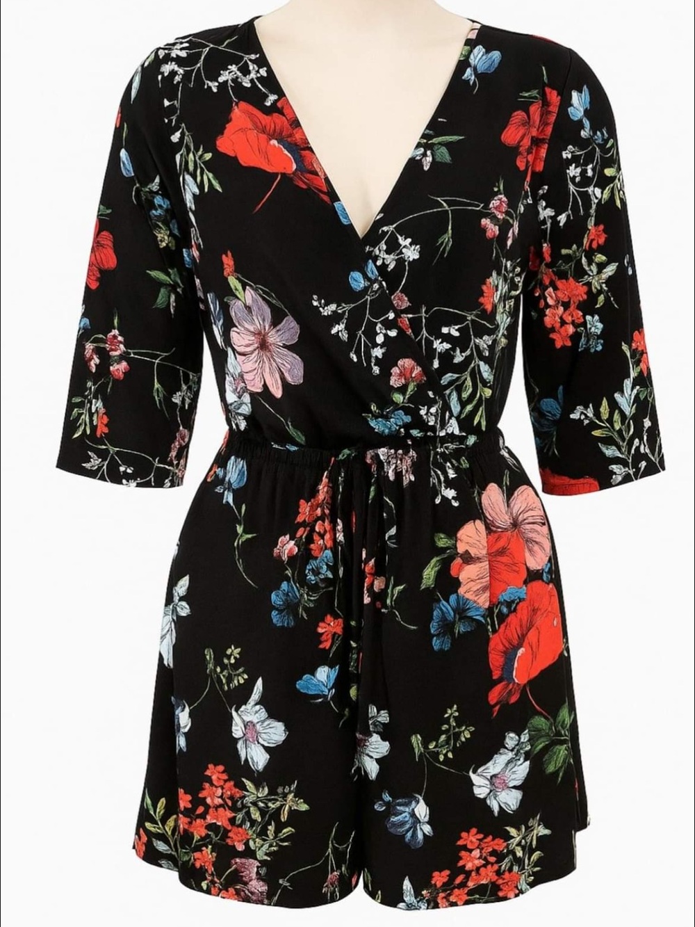 Kaileigh Black Floral Romper with Red & Blue Accents. Elastic waist with tie.
